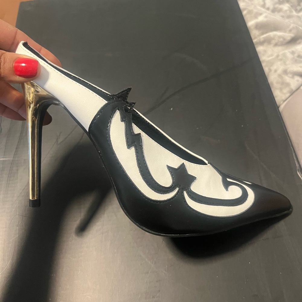Chic Black and White Heels with Gold Accents
